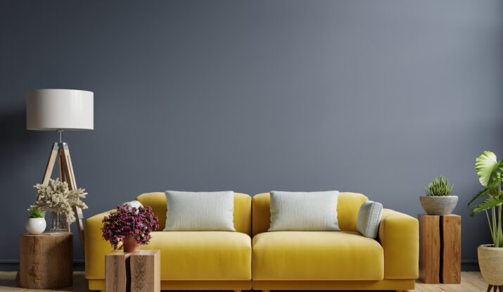 Interior mockup dark blue wall with yellow sofa and decor in living room